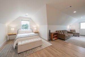 The bedroom and living area at an Austin, Texas rental to relax in after exploring a local waterfall.